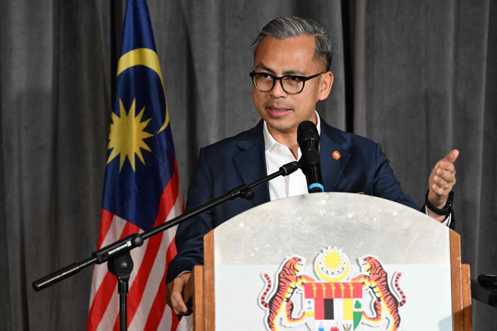 Malaysia's Minister of Communications Fahmi Fadzil answers questions regarding the hosting of the 2026 Commonwealth Games during a press conference in Kuala Lumpur on March 22, 2024. (Photo by Mohd Rasfan / AFP)
 