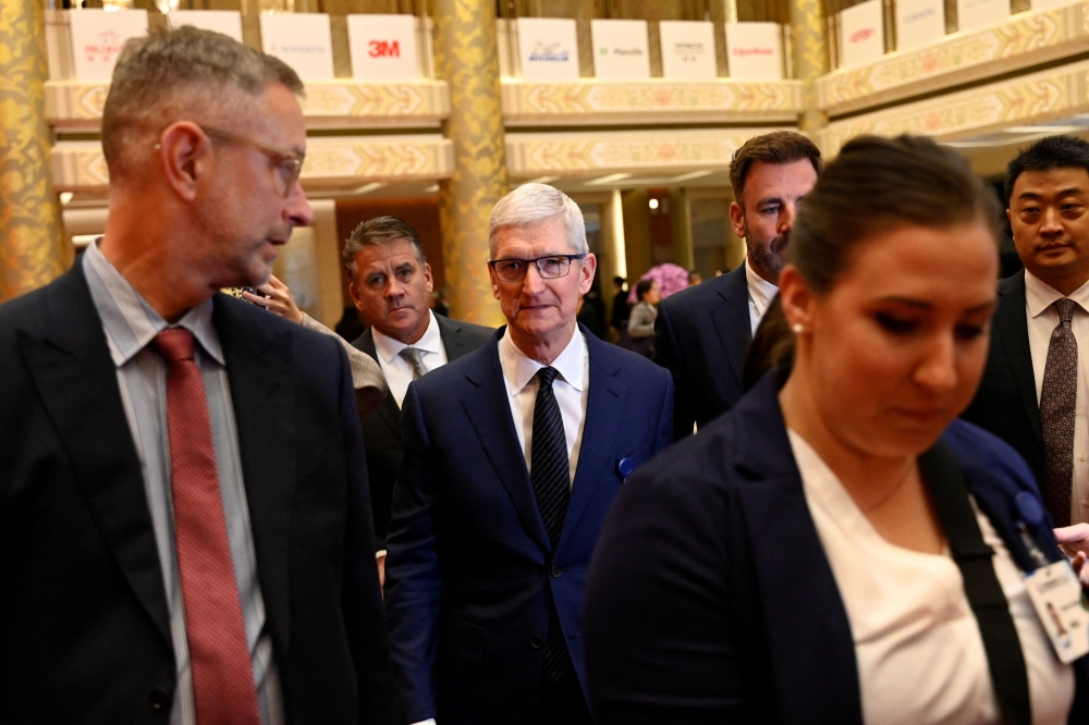 Apple's Chief Executive Officer Tim Cook arrives to the China Development Forum in Beijing on March 24, 2024. Photo Credit: Pedro Pardo / AFP.