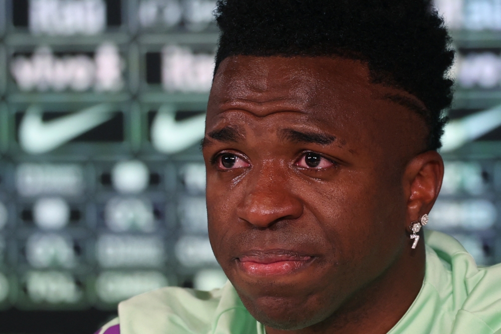 Brazil's forward Vinicius Junior cries as he gives a press conference on the eve of the international friendly football match between Spain and Brazil at the Ciudad Real Madrid training ground in Valdebebas, outskirts of Madrid, on March 25, 2024. (Photo by Pierre-Philippe MARCOU / AFP)

