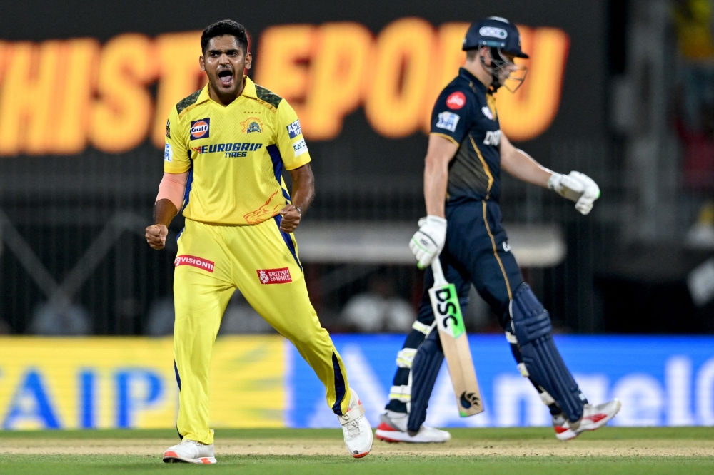 Chennai Super Kings' Tushar Deshpande (L) celebrates after taking the wicket of Gujarat Titans' David Miller during the Indian Premier League (IPL) Twenty20 cricket match between Chennai Super Kings and Gujarat Titans at the MA Chidambaram Stadium in Chennai on March 26, 2024. (Photo by R. Satish BABU / AFP)
