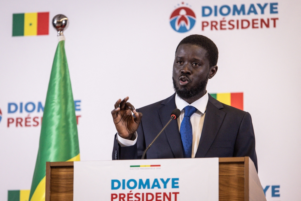 Senegalese opposition presidential candidate Bassirou Diomaye Faye addresses his first press conference after being declared winner of Senegal's presidential election, in Dakar, on March 25, 2024. (Photo by JOHN WESSELS / AFP)
