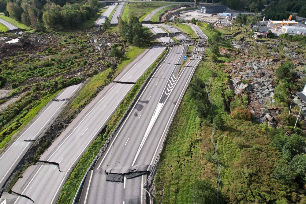 Aerial view taken on September 24, 2023 shows large damages at the E6 highway near Stenungsund, Sweden. Photo by Hanna Brunlof WINDELL / TT News Agency / AFP