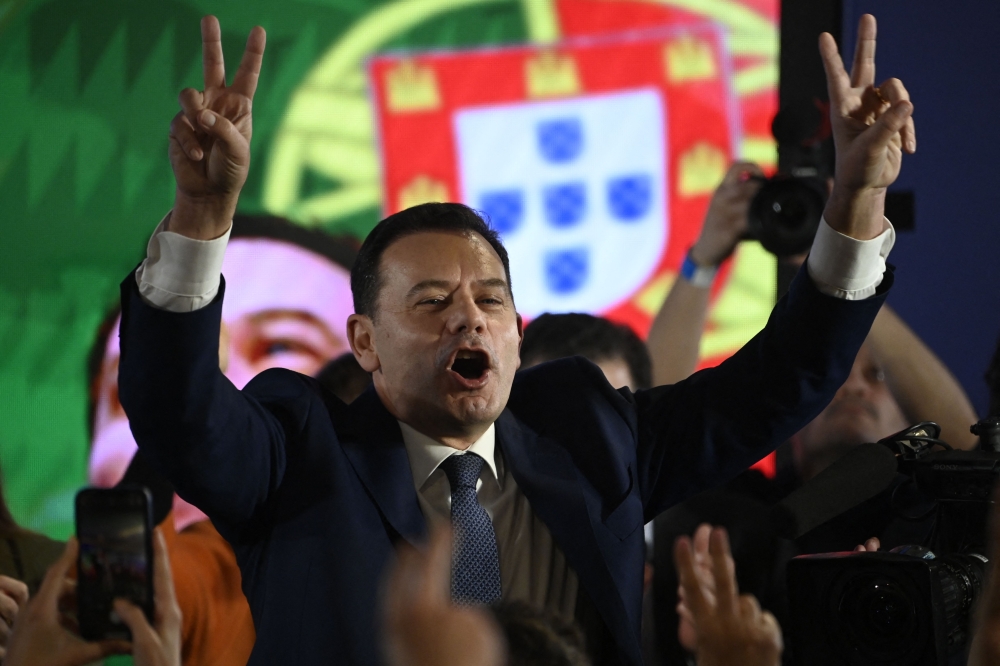 Democratic Alliance leader Luis Montenegro celebrates his victory as he addresses supporters at the party's election night headquarters, in Lisbon on March 10, 2024. (Photo by Miguel Riopa / AFP)