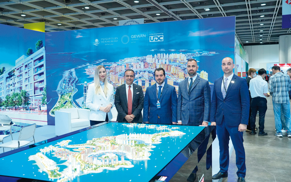 Officials pose for a group photo at the International Immigration & Property Expo 2024 in Hong Kong.