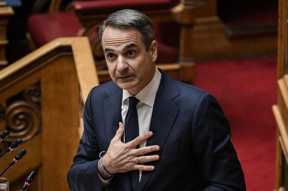 Greek Prime Minister Kyriakos Mitsotakis addresses lawmakers at parliament, ahead of a vote on confidence following a motion of censure submitted by leftist and centre-left opposition parties, in Athens on March 28, 2024. (Photo by Aris Messinis / AFP)