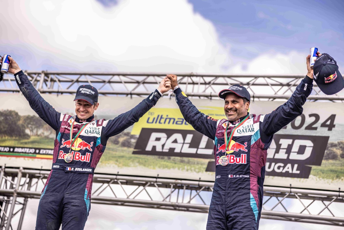 Nasser Saleh Al Attiyah (right) and his co-driver Edouard Boulanger celebrate their Rally-Raid Portugal triumph. 