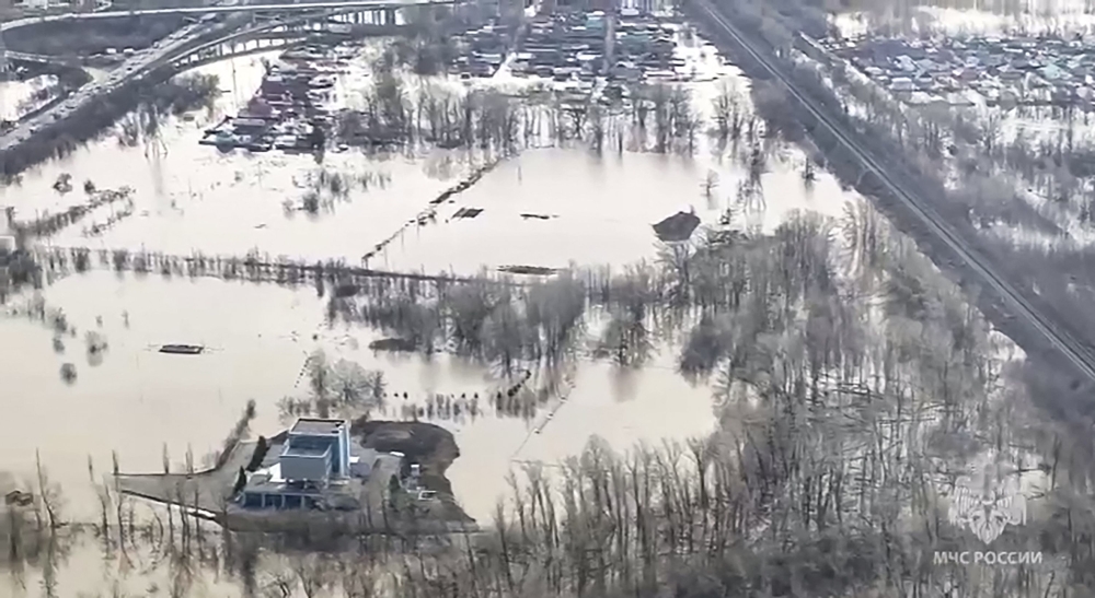 Grab taken from an aerial handout footage on April 9, 2024 shows flooded area in the Orenburg region, southeast of the southern tip of the Ural Mountains. (Photo by Handout / Russian Emergency Situations Ministry / AFP) 