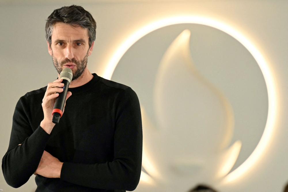 French President of the Paris 2024 Olympics and Paralympics Organising Committee (Cojo) Tony Estanguet delivers a speach during a press conference three months ahead of the Olympic at the headquarters of the Paris 2024 Olympics in the Saint-Denis suburb of Paris, on April 10, 2024. (Photo by Bertrand GUAY / AFP)