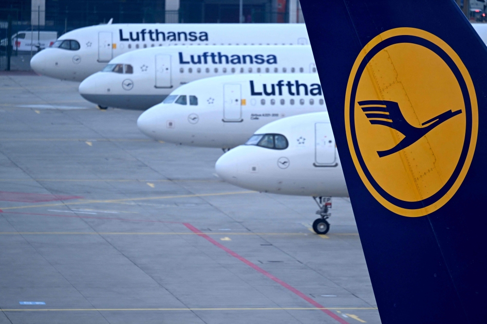 File: The logo of German airline Lufthansa can be seen on the vertical stabilizer of a plane standing with other Lufthansa aircrafts at the airport in Frankfurt am Main, western Germany, on March 7, 2024. (Photo by Kirill Kudryavtsev / AFP)
