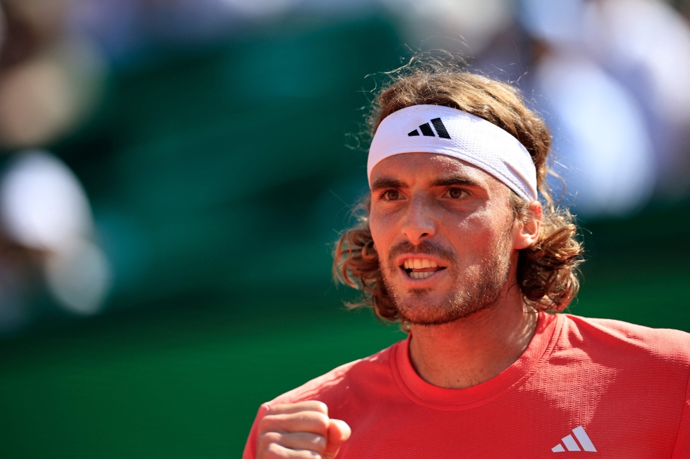 Greece's Stefanos Tsitsipas reacts after a point against Russia's Karen Khachanov during their Monte Carlo ATP Masters Series Tournament quarter final tennis match on the Rainier III court at the Monte Carlo Country Club in Monaco on April 12, 2024. (Photo by Valery HACHE / AFP)
