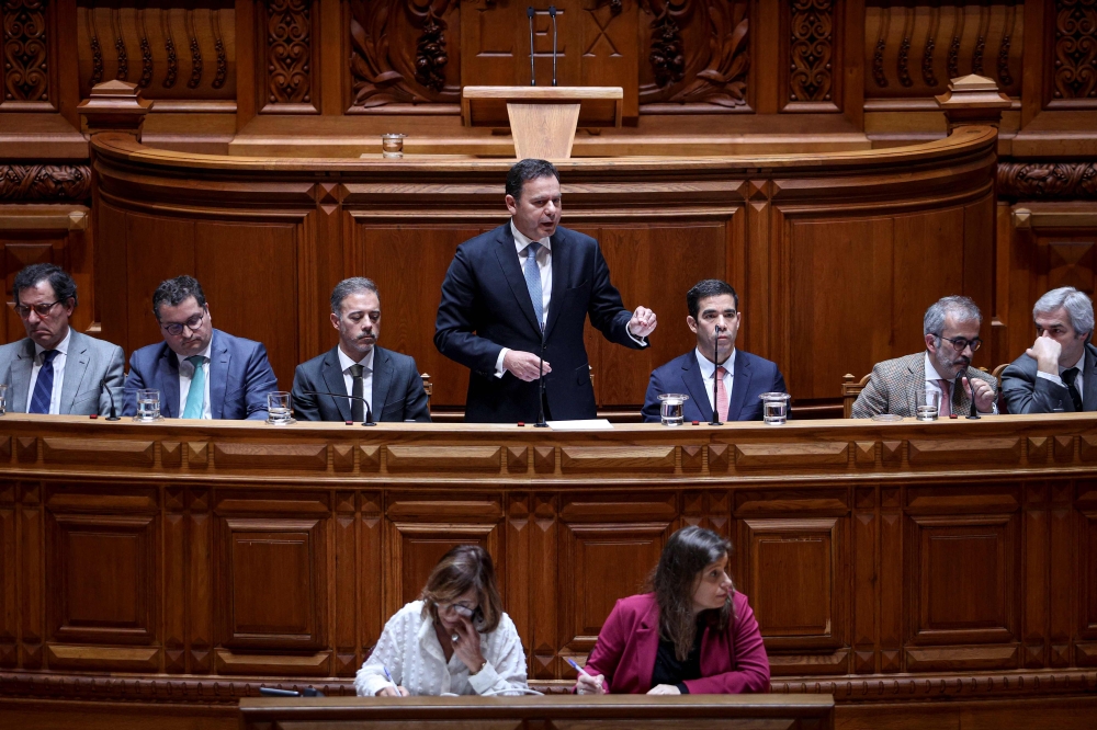 Portuguese Prime Minister Luis Montenegro speaks during a debate on his government's program at the Portuguese parliament in Lisbon, on April 11, 2024. (Photo by FILIPE AMORIM / AFP)
