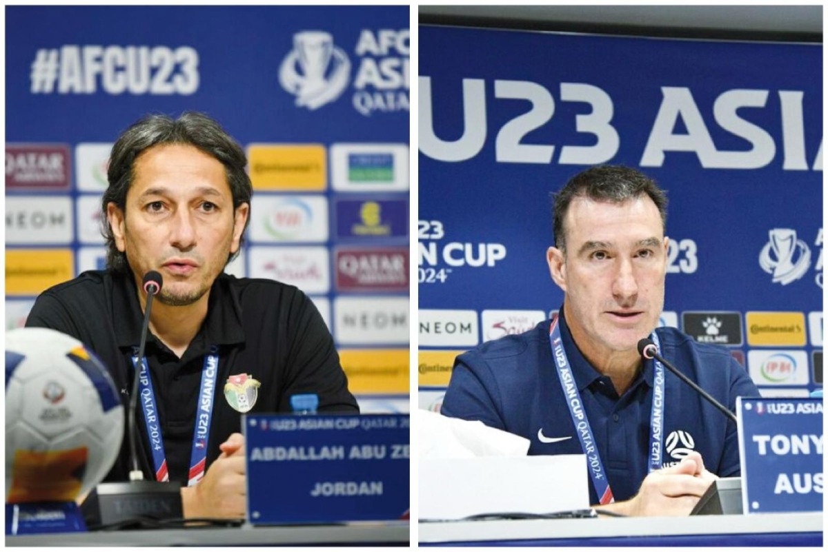 Jordan coach Abdallah Abu Zema (left) and Australia coach Tony Vidmar speak ahead of their opening match. PICS: AFC