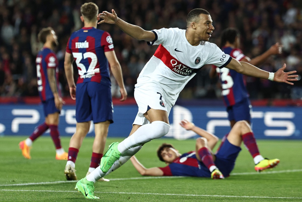 Kylian Mbappe celebrates after scoring his team’s third goal from the penalty spot. AFP