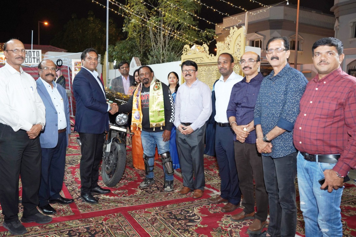 Officials present a memento to Gabriel Sharath (fourth left) during the event.