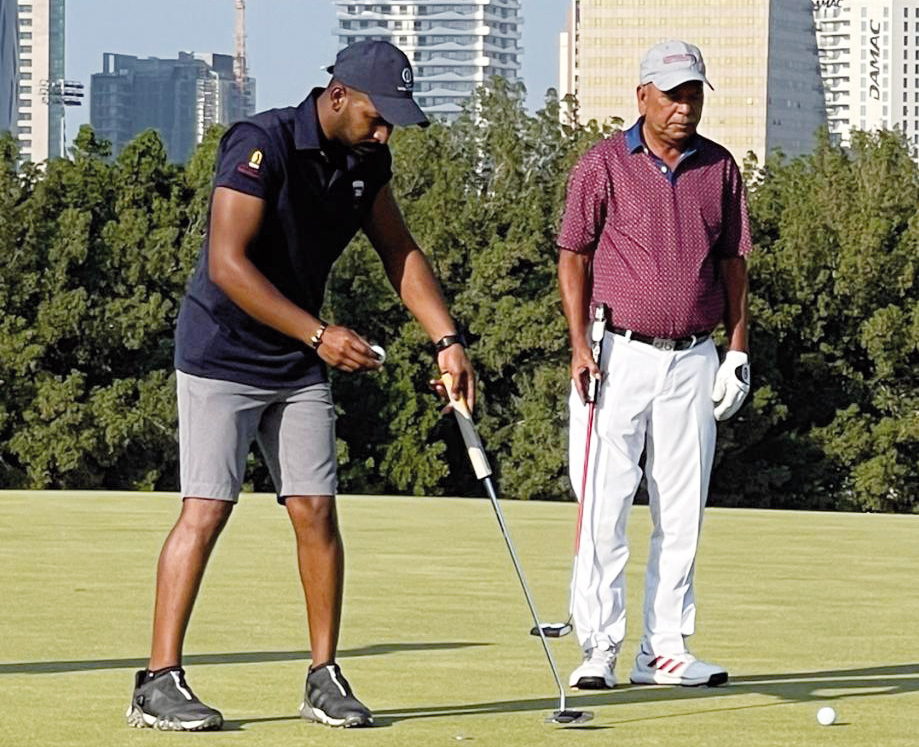 Qatar’s Saleh Al Kaabi (left) in action during the opening round of Qatar Open Amateur Golf Championship.  