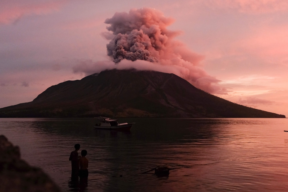 Mount Ruang volcano erupts in Sitaro, North Sulawesi, on April 19, 2024. (Photo by Ronny Adolof Buol / AFP)