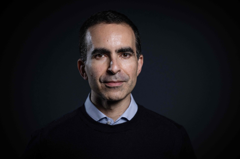 French CEO of InstaDeep Karim Beguir poses during a photo session in Paris, on April 8, 2024. (Photo by Julien De Rosa/ AFP)