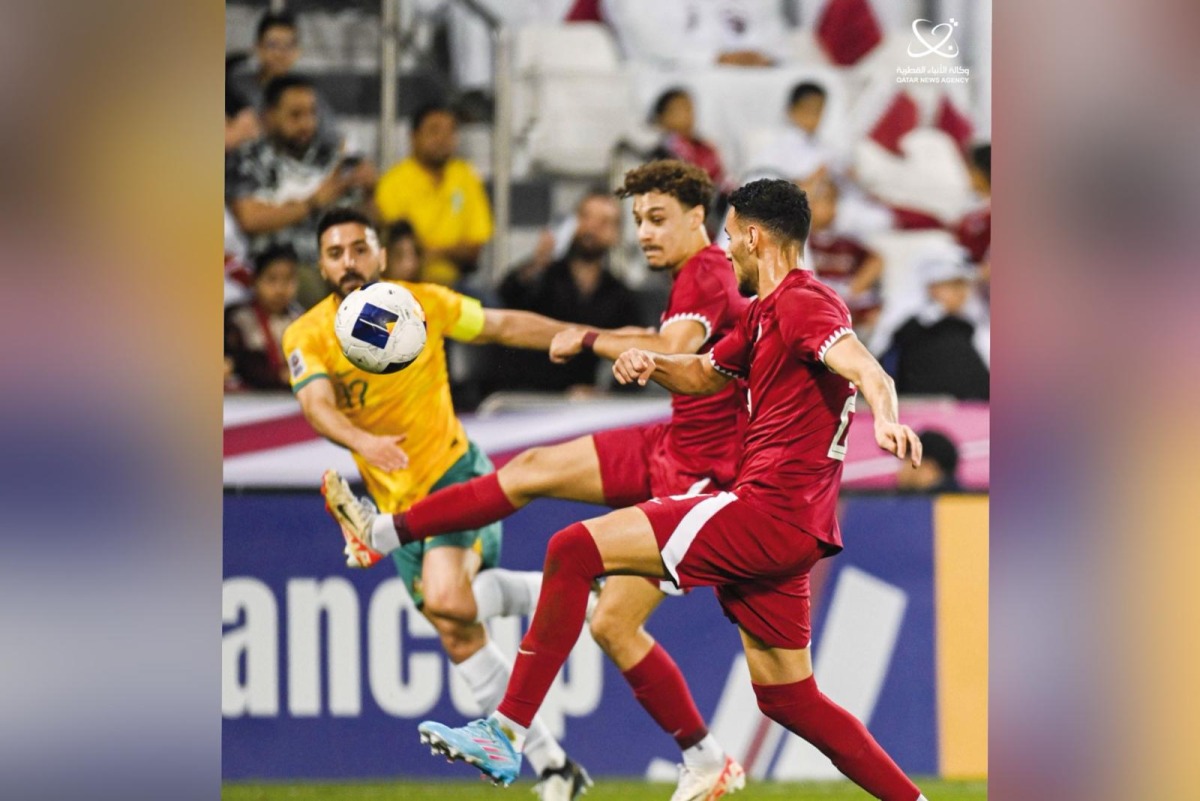 Qatar and Australia players in action during their last Group A match.