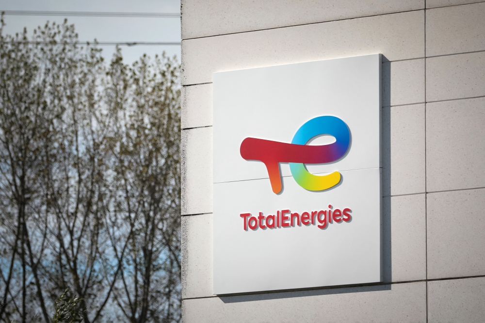 A photograph shows the logo of TotalEnergies at the Total Energies refinery site, in Gonfreville-l'Orcher, near Le Havre, northwestern France, on October 5, 2022. Photo by Lou BENOIST / AFP.