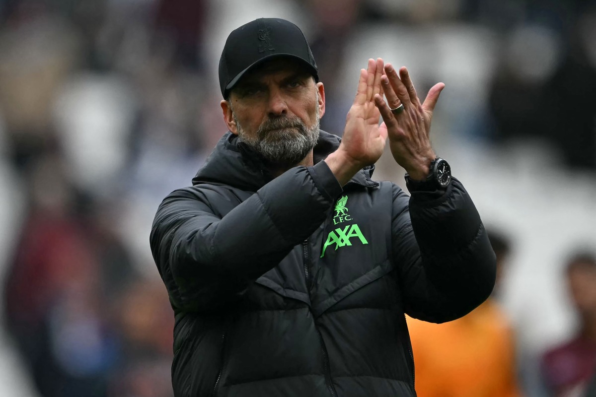 Liverpool's German manager Jurgen Klopp applauds fans on the pitch after the English Premier League football match between West Ham United and Liverpool at the London Stadium, in London on April 27, 2024. The game ended 2-2. (Photo by Ben Stansall / AFP)