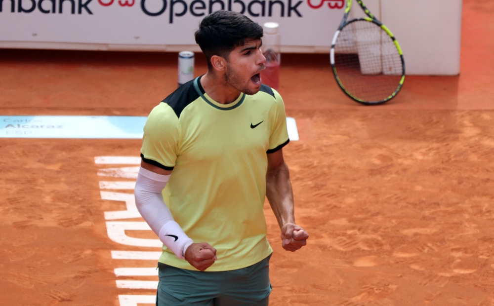 Spain's Carlos Alcaraz celebrates victory at the end of the third round of the 2024 ATP Tour Madrid Open tournament tennis match against Brazil's Thiago Seyboth Wild at Caja Magica in Madrid on April 28, 2024. (Photo by Thomas COEX / AFP)
