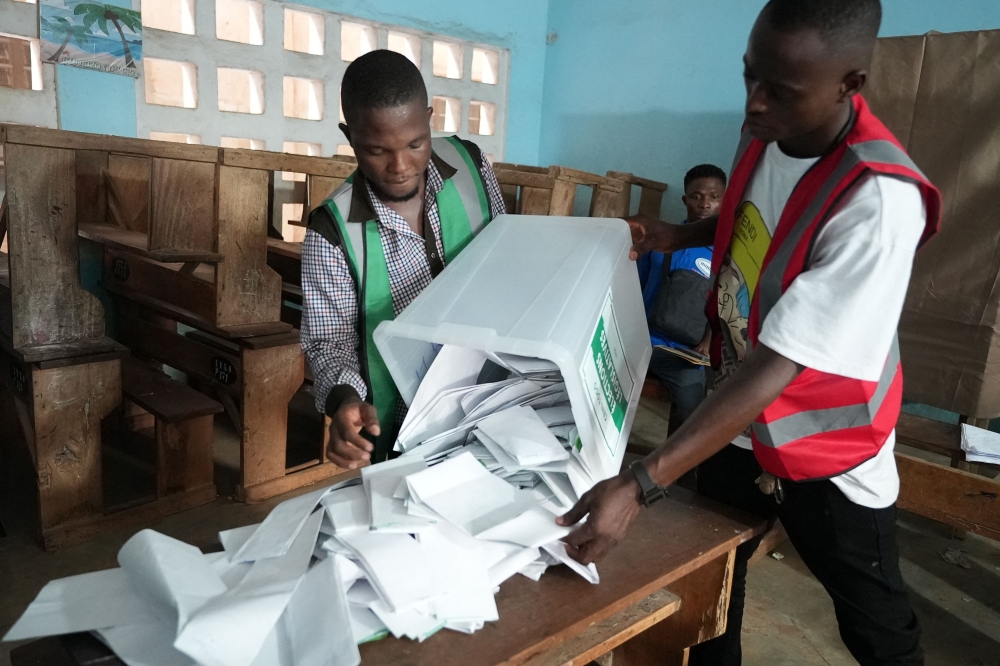 Electoral officials prepare the counting of votes at a polling station in Lome on April 29, 2024, during Togo's legislative elections. (Photo by Emile KOUTON / AFP)
