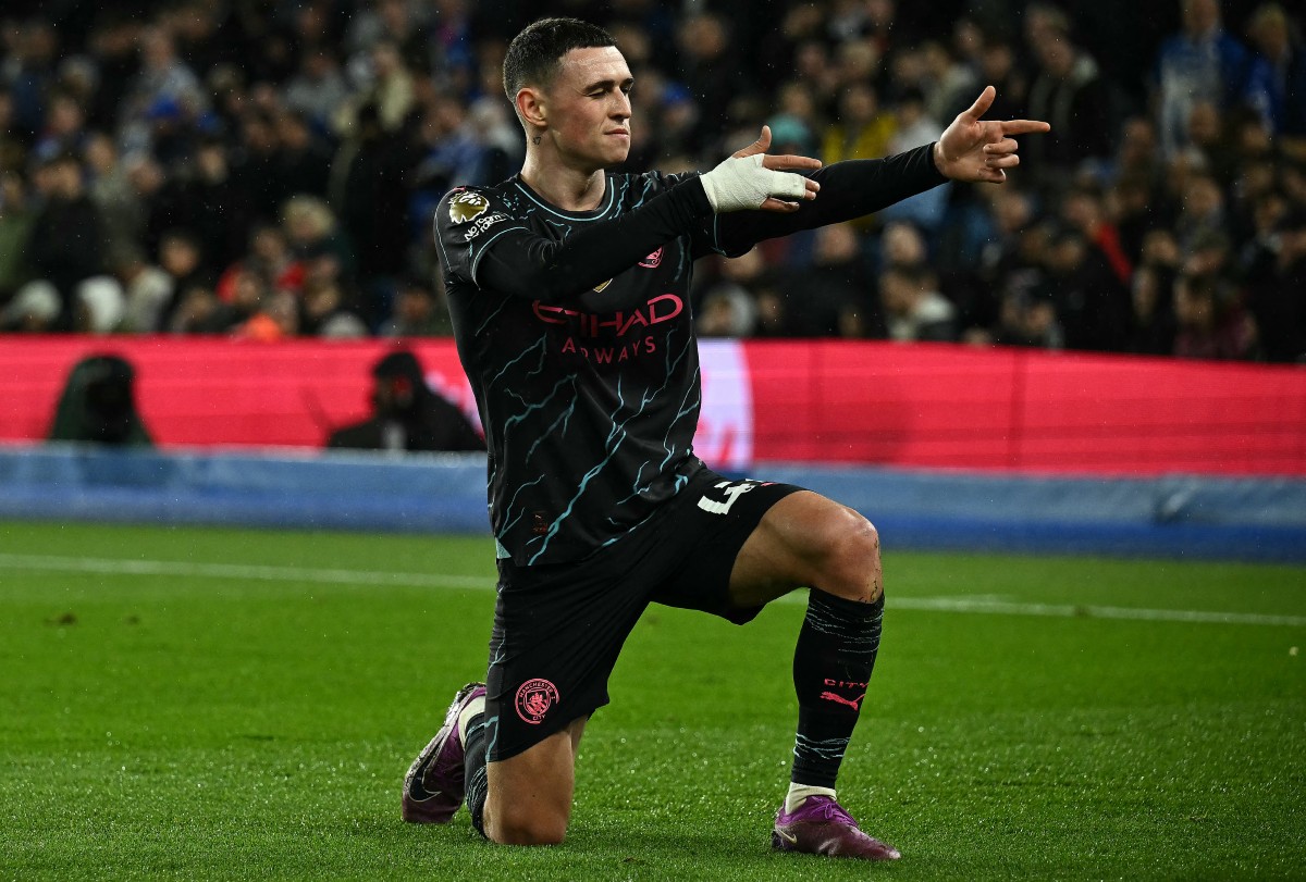 Manchester City's English midfielder #47 Phil Foden celebrates scoring the team's third goal, his second, during the English Premier League football match between Brighton and Hove Albion and Manchester City at the American Express Community Stadium in Brighton, southern England on April 25, 2024. (Photo by Ben Stansall / AFP)