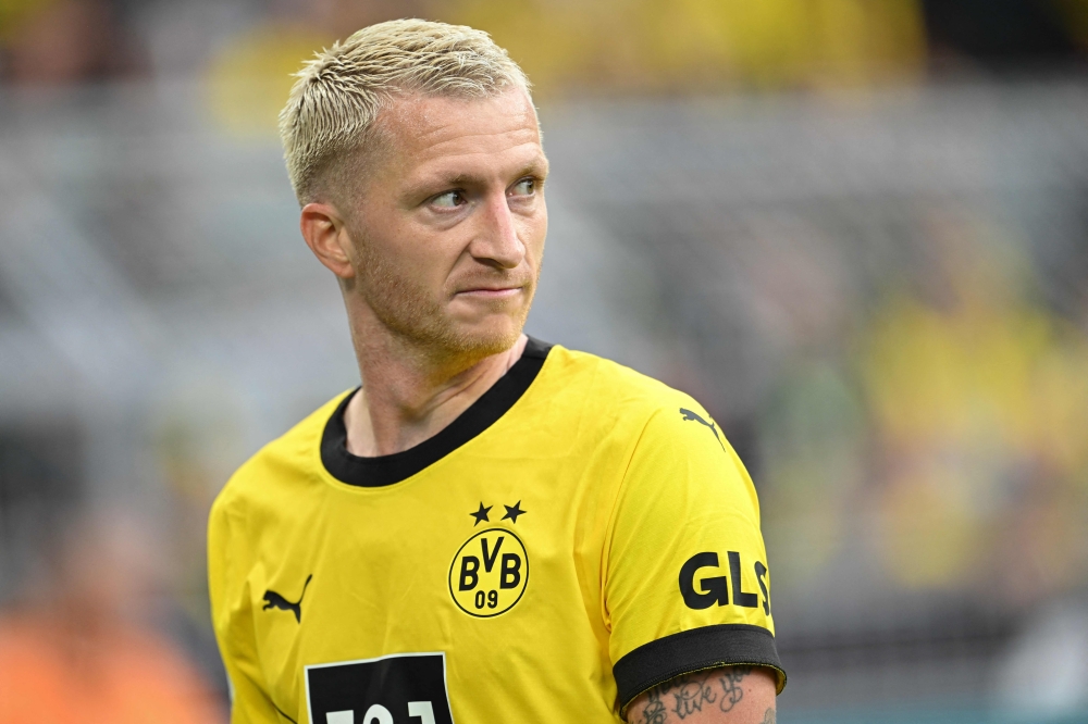 Dortmund's German forward #11 Marco Reus reacts during the German first division Bundesliga football match between Borussia Dortmund and VfL Wolfsburg in Dortmund, western Germany, on September 23, 2023. Photo by INA FASSBENDER / AFP