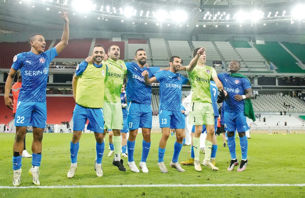 Al Shahania players celebrate after the win.