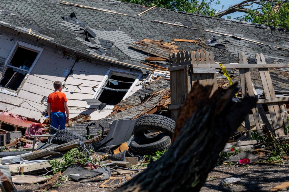 Zack Crowder views his home after it was struck by a tornado on May 07, 2024 in Barnsdall, Oklahoma. Barnsdall, a small town with a population of approximately 1,000 people, was struck last night by an EF3 tornado. (Photo by Brandon Bell / GETTY IMAGES NORTH AMERICA / Getty Images via AFP)
