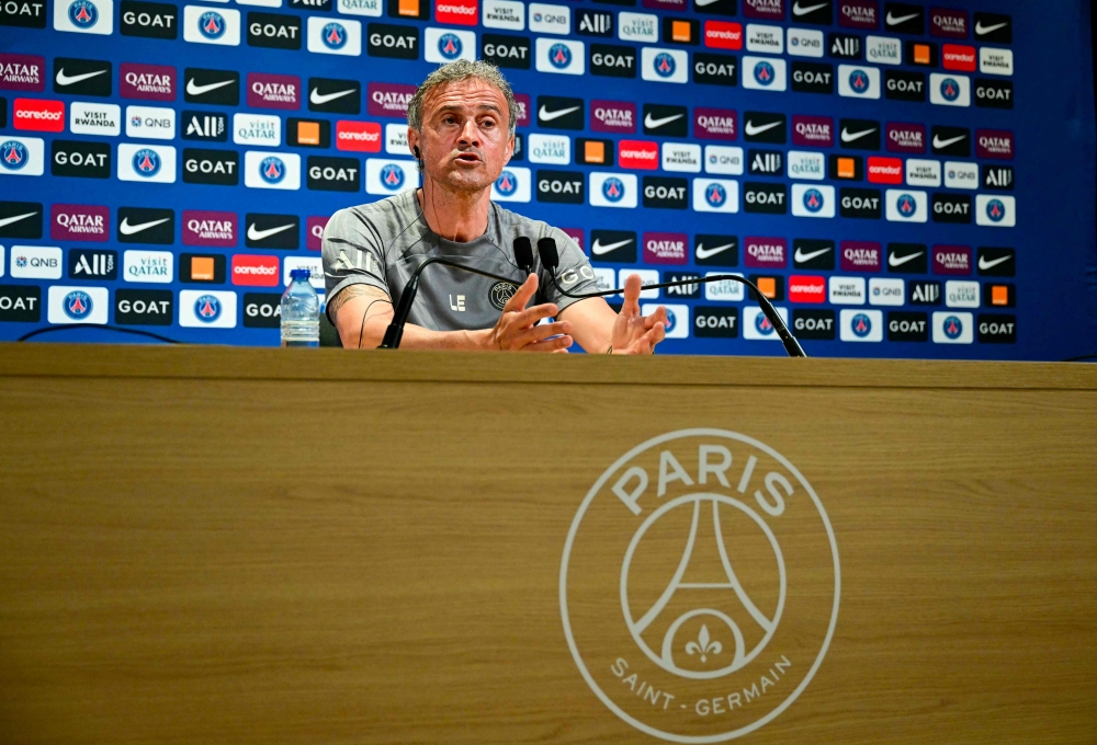 Paris Saint-Germain's Spanish headcoach Luis Enrique addresses a press conference at the club's 