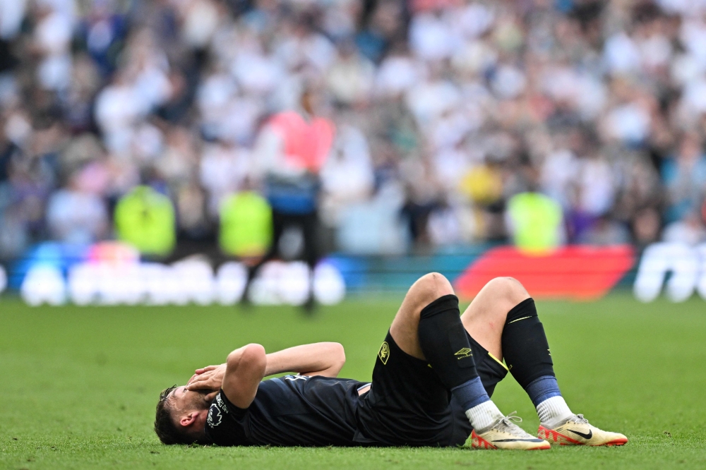 Burnley's English defender #03 Charlie Taylor reacts at the end of the English Premier League football match between Tottenham Hotspur and Burnley at the Tottenham Hotspur Stadium in London, on May 11, 2024. (Photo by Glyn KIRK / AFP)