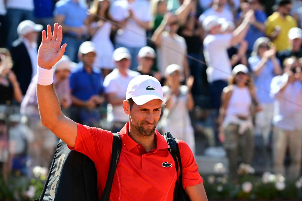 Serbia's Novak Djokovic waves to fans as he leaves the court after being defeated by Chile's Alejandro Tabilo at the Men's ATP Rome Open tennis tournament at Foro Italico in Rome on May 12, 2024. (Photo by Tiziana FABI / AFP)