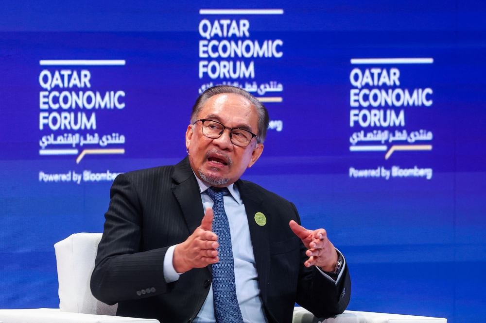 Malaysia's Prime Minister Anwar Ibrahim speaks at the Qatar Economic Forum in Doha on May 14, 2024. (Photo by Karim Jaafar / AFP)