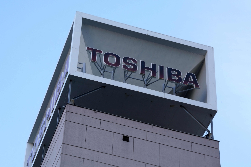 The logo of Japanese industrial group Toshiba is seen on top of a building at their headquarters in Tokyo on December 20, 2023. Photo by Kazuhiro NOGI / AFP