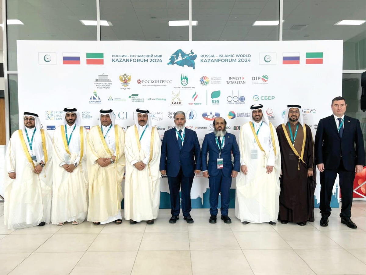 Minister of Awqaf and Islamic Affairs H E Ghanem bin Shaheen Al Ghanim (centre) and  Tatarstan’s President H E Rustam Minnikhanov (first right)  along with officials during the forum.    