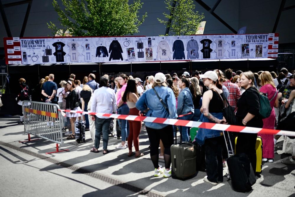 Fans are queuing outside Friends arena in Stockholm, Sweden May 17, 2024 before a concert of US singer-songwriter Taylor Swift on her Eras Tour. (Photo by Pontus LUNDAHL / TT News Agency / AFP)