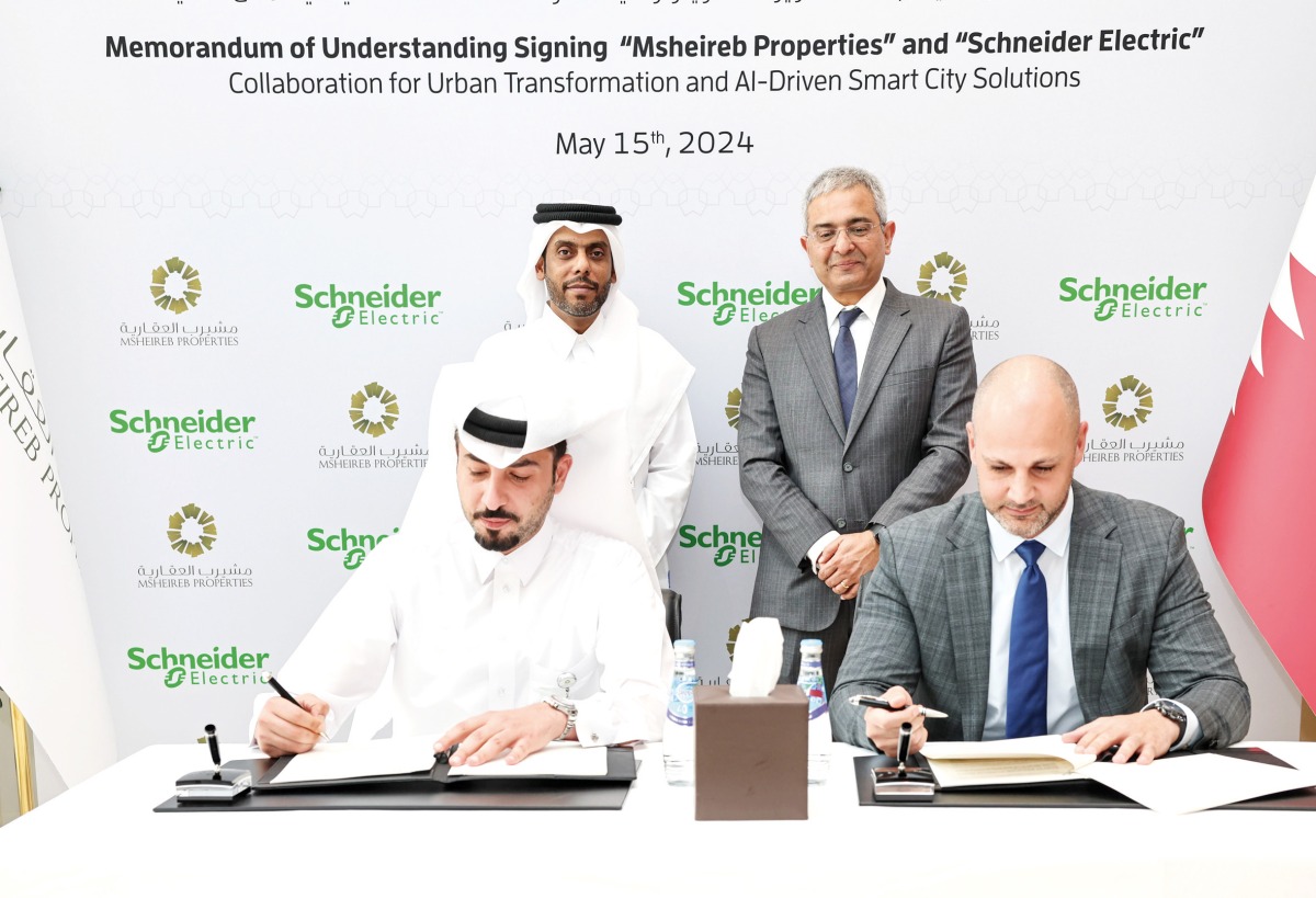 Msheireb Properties and Schneider Electric officials during the signing ceremony.
