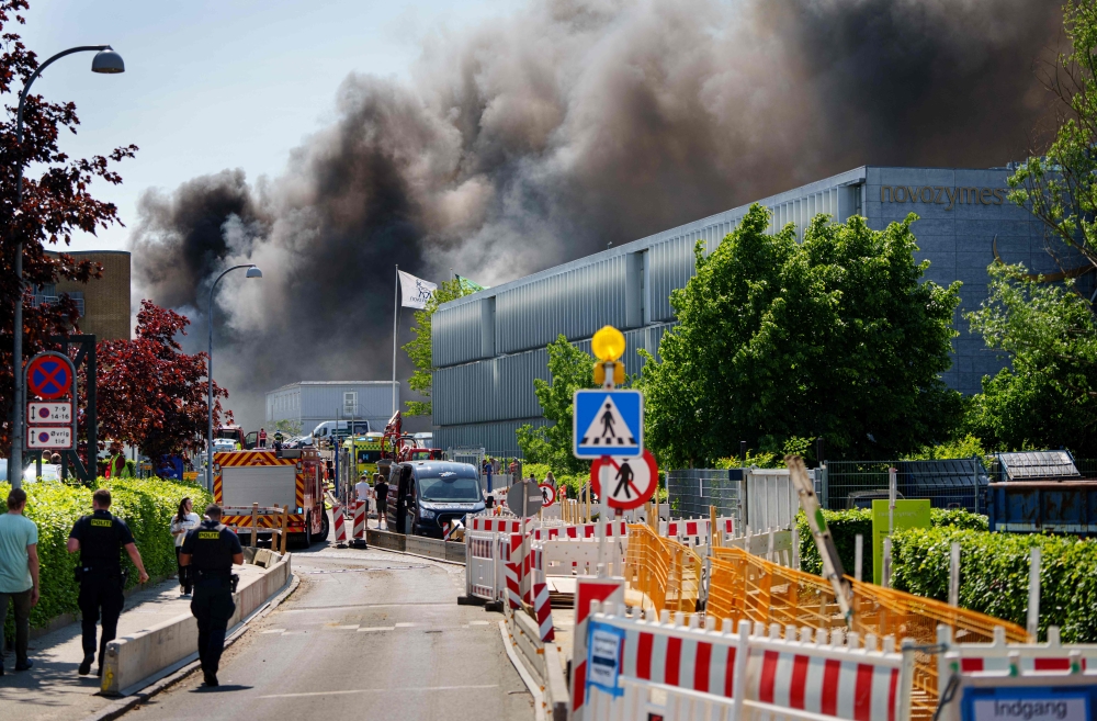 Plumes of smoke are seen after a fire broke out at an office building belonging to Danish pharmaceutical group Novo Nordisk in Bagsvaerd near Copenhagen, Denmark, on May 22, 2024. Photo by Liselotte Sabroe / Ritzau Scanpix / AFP