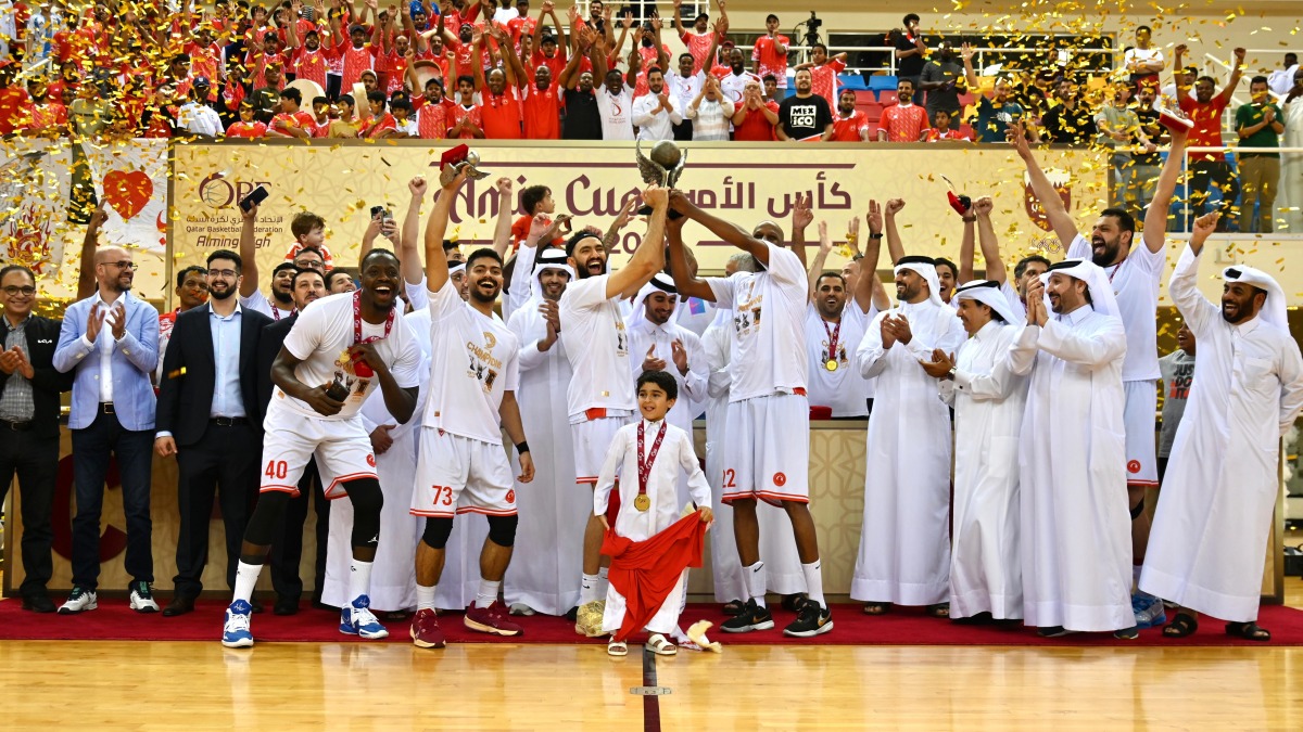 Al Arabi players and officials celebrate with the Amir Cup trophy after winning the final against Al Sadd yesterday. Al Arabi President Sheikh Tamim bin Fahd Al Thani received the trophy from the First Vice President of Qatar Olympic Committee Mohammed bin Yousef Al Mana, in the presence of the Qatar Basketball Association President Mohammed Saad Al Mughaiseeb.
