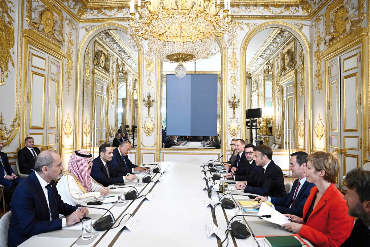 France’s President H E Emmanuel Macron attends a meeting with Prime Minister and Minister of Foreign Affairs H E Sheikh Mohammed bin Abdulrahman bin Jassim Al Thani (third left); Saudi Foreign Minister H H Prince Faisal bin Farhan Al Saud (second left); Jordanian Foreign Minister H E Ayman Safadi (first left); and Egypt Foreign Minister H E Sameh Shoukry (fourth left) for talks on the war in Gaza, at the Elysee Presidential Palace in Paris yesterday. (AFP) 