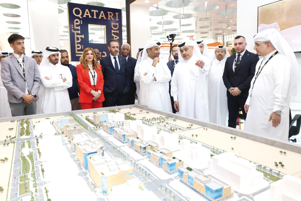Minister of Finance H E Ali bin Ahmed Al Kuwari with other dignitaries and officials touring a pavilion during the inauguration of Project Qatar 2024 at DECC, yesterday.