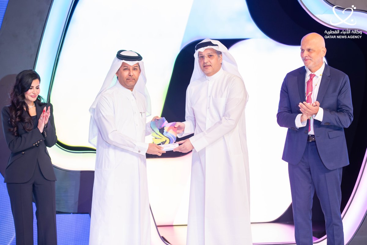 Minister of Communications and Information Technology H E Mohammed bin Ali Al Mannai (right) presenting the award  to Director-General of Qatar News Agency Ahmed bin Saeed Al Rumaihi. 