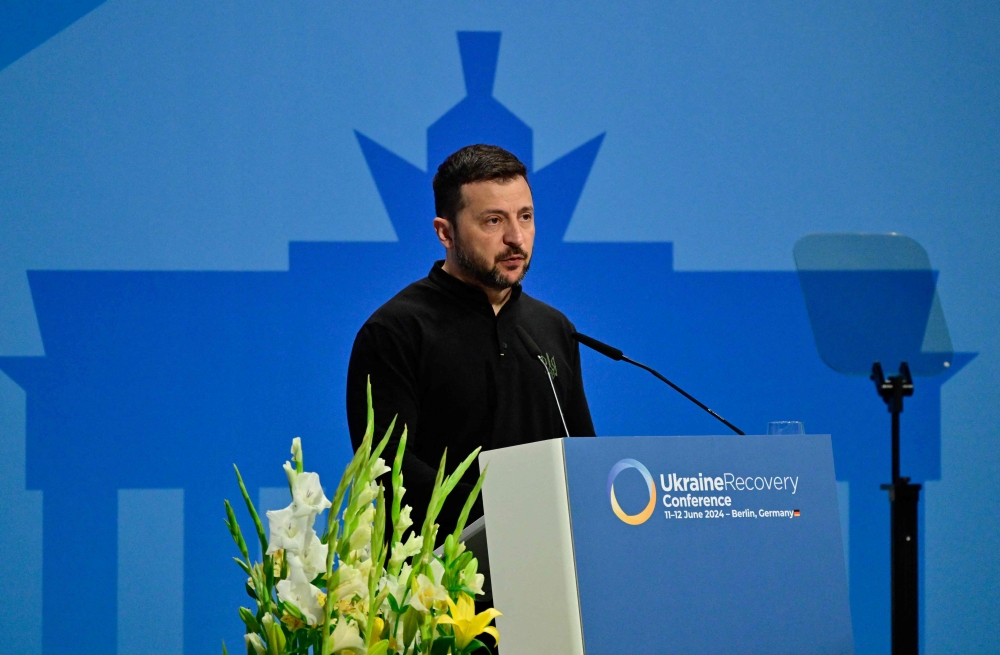 Ukrainian President Volodymyr Zelensky gives a speech to open the Ukraine Recovery Conference in Berlin on June 11, 2024. Photo by JOHN MACDOUGALL / AFP