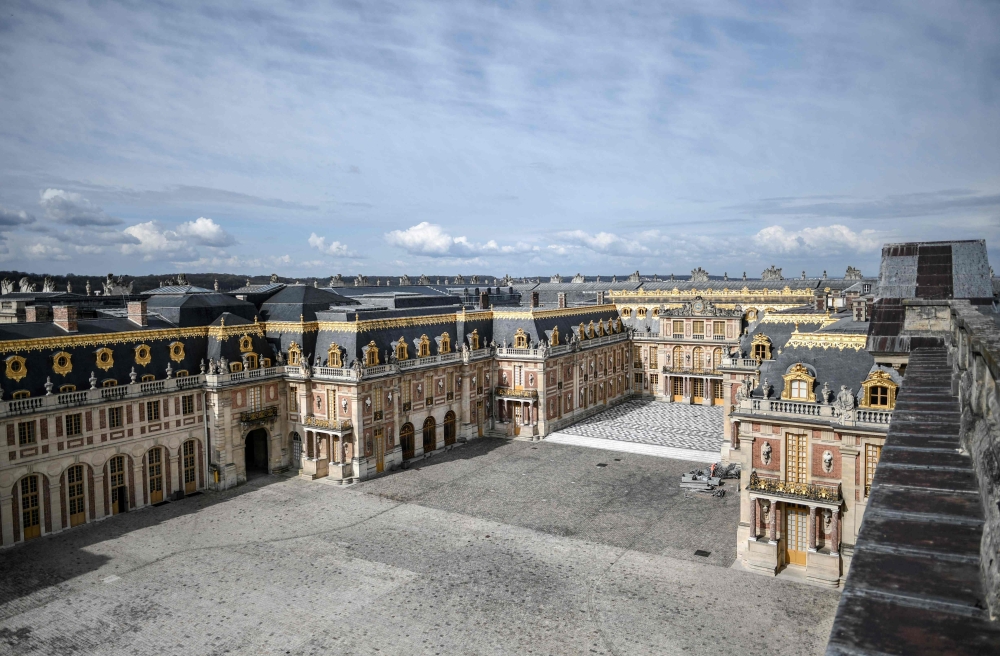 A picture taken on April 6, 2021 shows a partial view of the Chateau de Versailles (Palace of Versailles) in Versailles, outside Paris. Photo by STEPHANE DE SAKUTIN / AFP