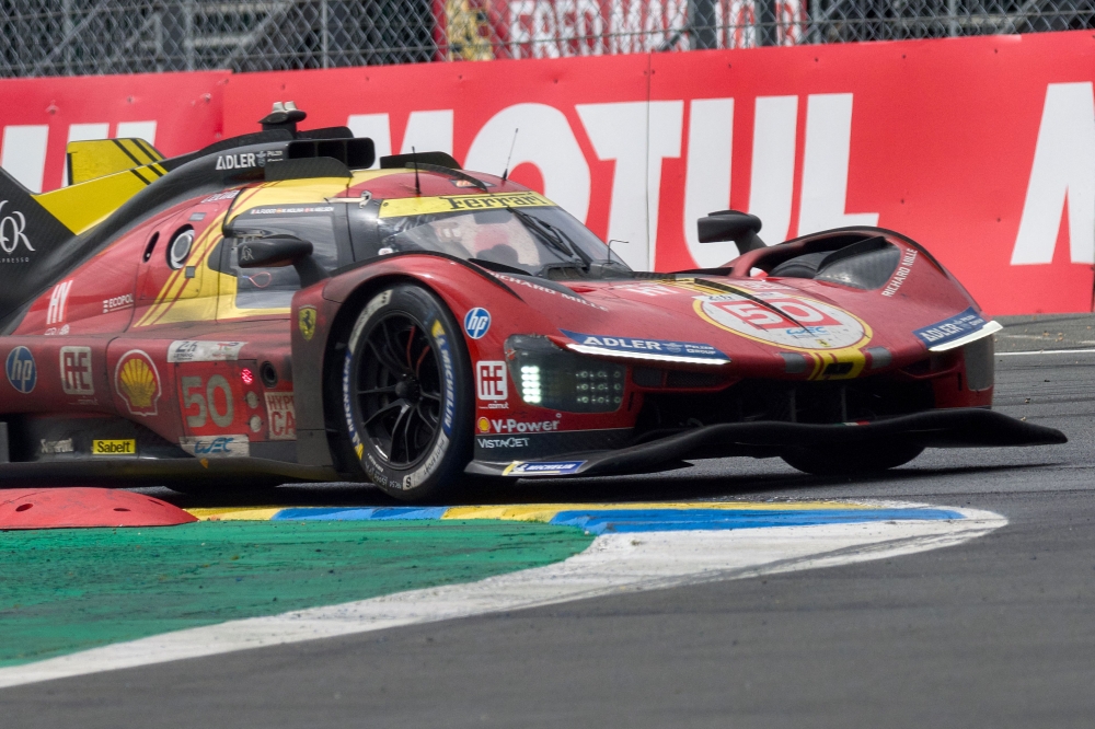 Italian driver Antonio Fuoco steers the Ferrari 499P during Le Mans 24-hours endurance race in Le Mans, western France, on June 16, 2024. (Photo by GUILLAUME SOUVANT / AFP)
