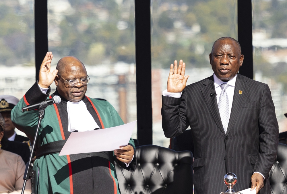 South Africa's Cyril Ramaphosa (R) gestures takes the oath of office for his second term as South African President at the Union Buildings in Pretoria on June 19, 2024. Photo by Kim LUDBROOK / POOL / AFP.