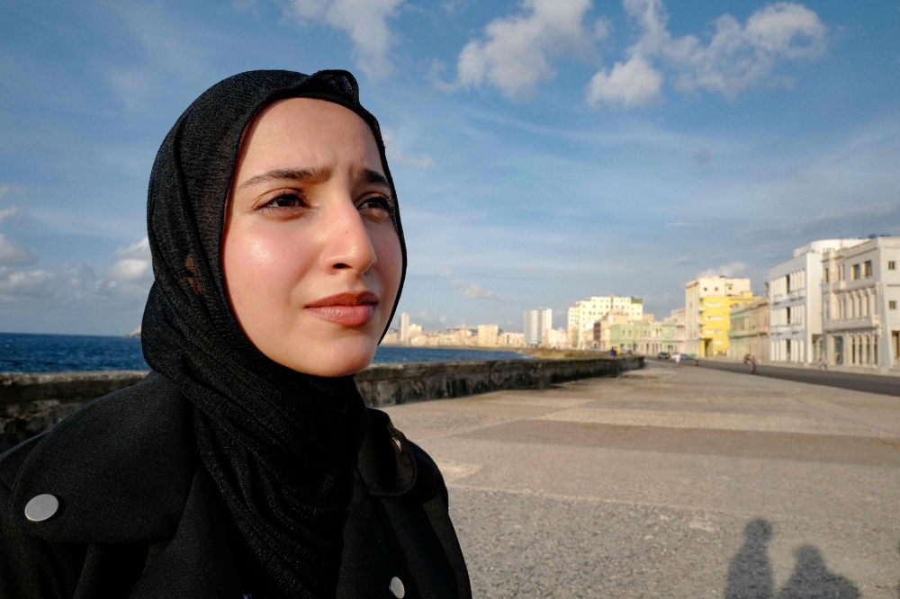 Samar Alghoul, 21, is pictured during an interview with AFP in Havana on June 2, 2024.  (Photo by ADALBERTO ROQUE / AFP)
