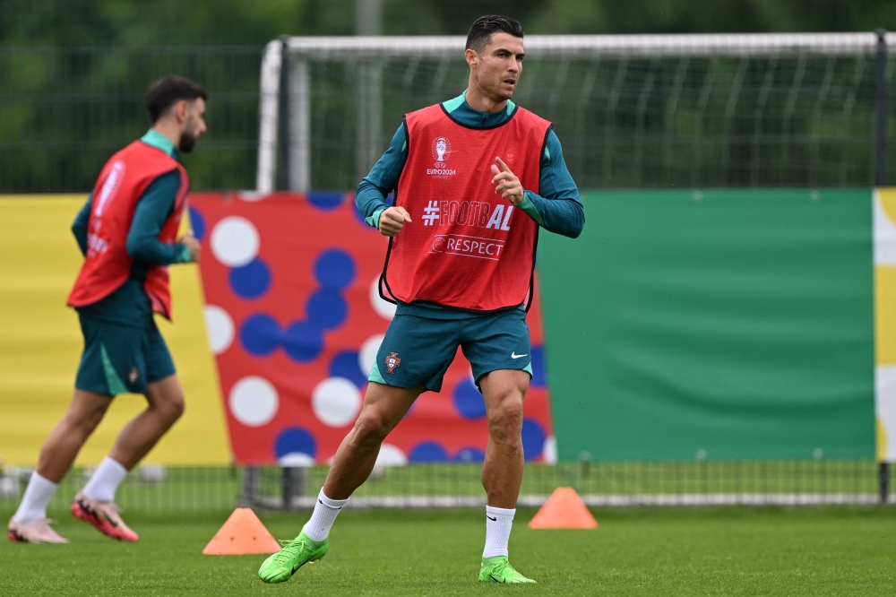 Portugal's forward #07 Cristiano Ronaldo takes part in the MD-1 training session in Marienfeld, a district of Harsewinkel City in Germany on June 21, 2024. (Photo by Patricia De Melo Moreira / AFP)