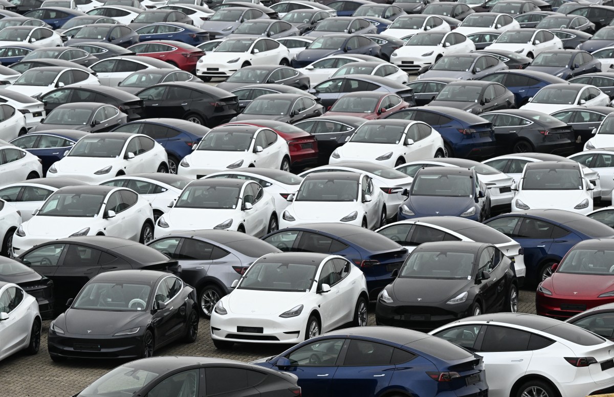 Tesla electric cars are stationed in a storage area in the Zeebrugge port, northern Belgium on June 21, 2024. Photo by JOHN THYS / AFP.